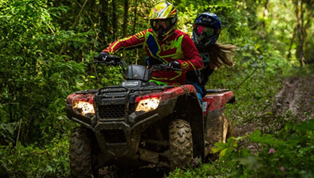 two riders on an ATV